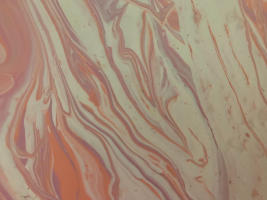 Close detail of a pour in peach, coral and bone